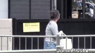 Japanese with big tits peeing on parking & later in