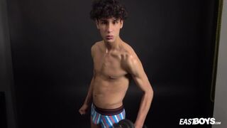 Curly twink boy shows off his slim body on webcam